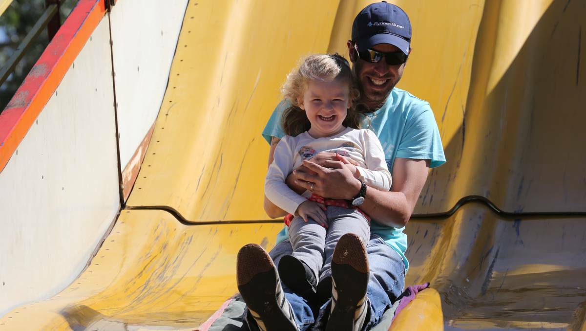 LA FESTA, GRIFFITH: Dean Wynne  takes daughter Dakota, 3, on the slide. Picture: Anthony Stipo, The Area News