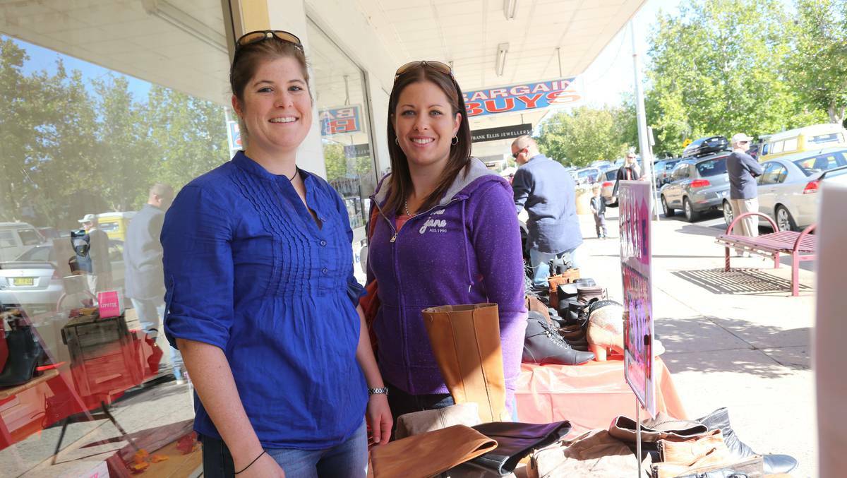 SIDE WALK SALE, GRIFFITH: Sisters Fiona and Lisa McKenzie look for a bargain. Picture: Anthony Stipo, The Area News