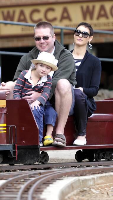 WAGGA: Five-year-old Axel Johnson of Wagga with his parents Luke and Kirsten on the Willans Hill Miniature Railway. The railway hosted a 12-hour ride-a-thon on Sunday. Picture: Les Smith, The Daily Advertiser