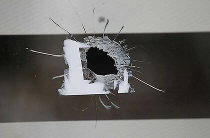 Lucky escape ... four children were asleep in a bedroom when a bullet came through the window.