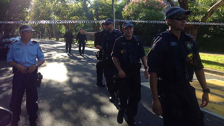 Riot Squad police conduct a line search up Jersey Road, Strathfield. Photo: Emma Partridge