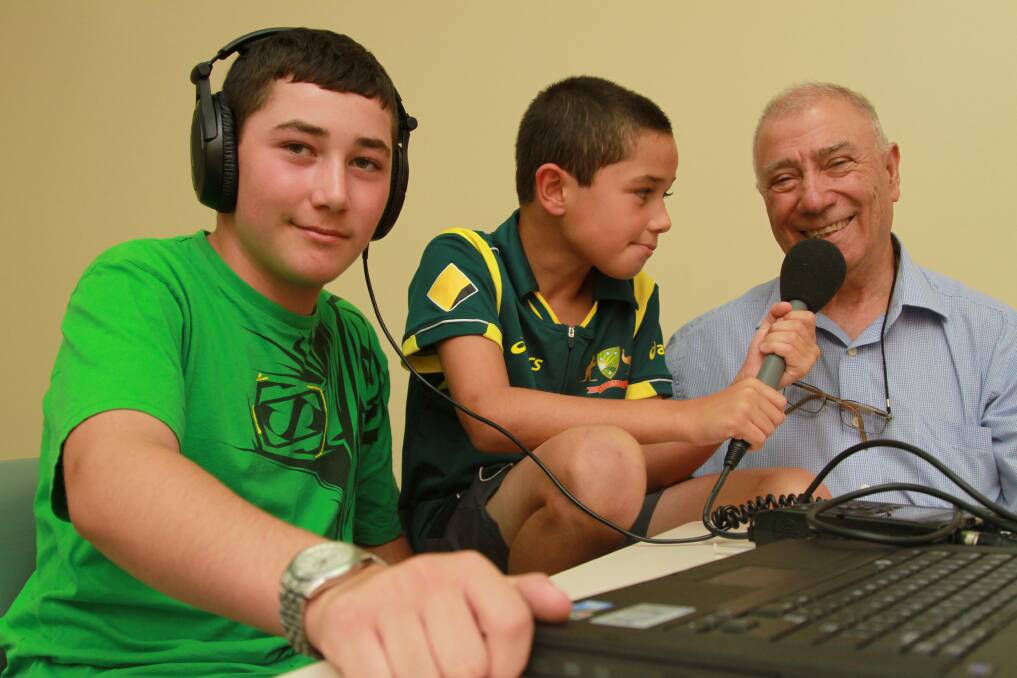WISE WORDS: Tom, 13 and Harry Catanzariti, 10, record the stories of their grandfather Joe Catanzariti at the library on Monday.
