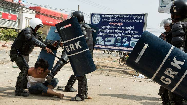 A man is arrested during a demonstration on January 3, 2014 in Phnom Penh, Cambodia.  Photo: Getty 