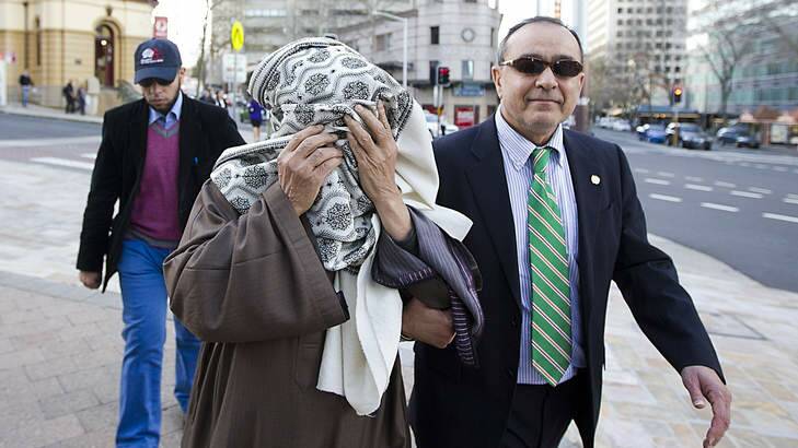 Guilty plea: Ahmed Abdelshafy Mohamed El-Kahly, centre, leaving court on Monday. Photo: Jenny Evans