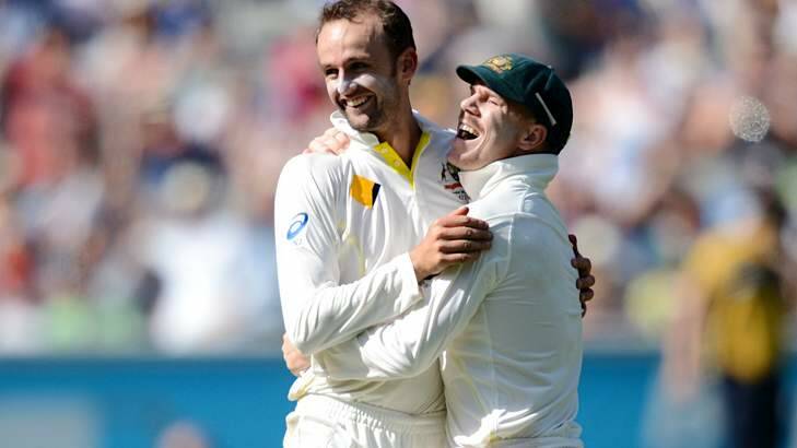 Come in spinner: Nathan Lyon and Dave Warner celebrate another wicket. Photo: Pat Scala