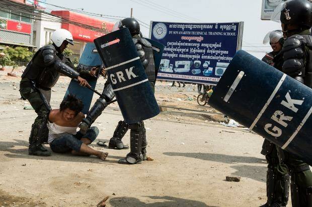 A man is arrested during a demonstration on January 3, 2014 in Phnom Penh, Cambodia.  Photo: Getty 