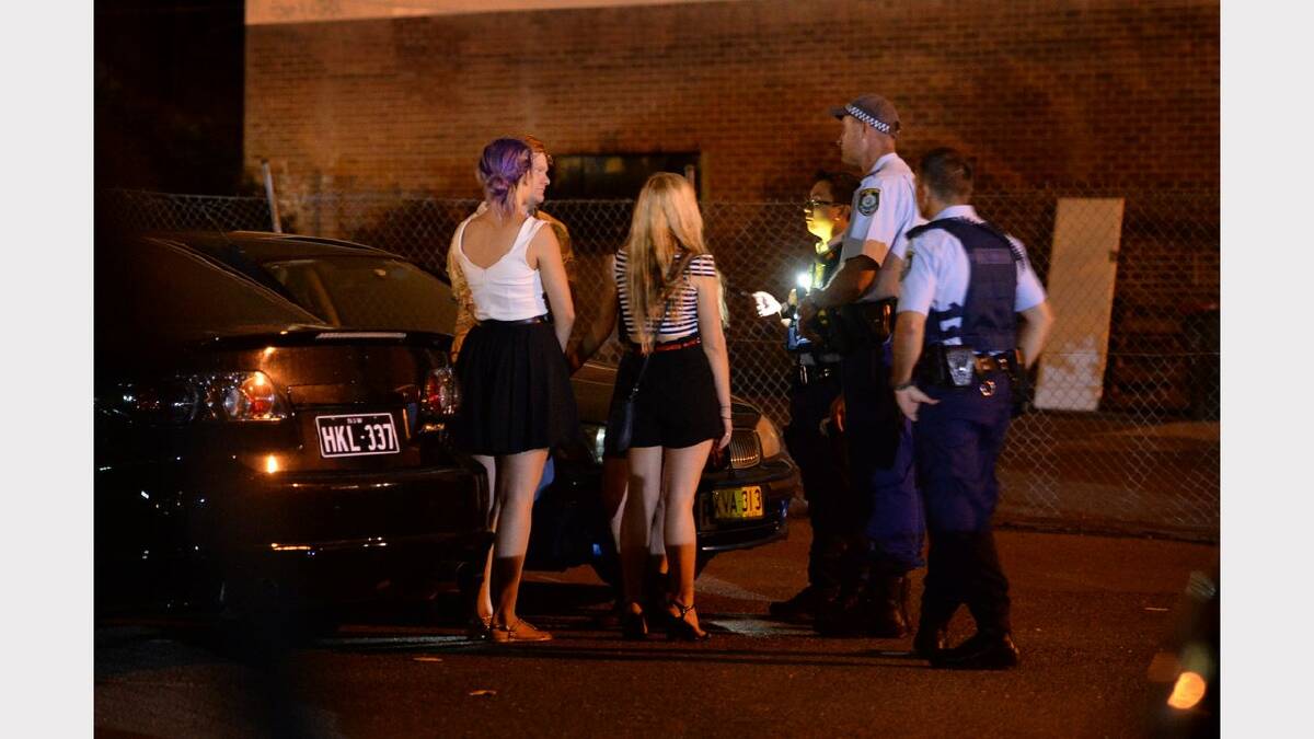 Wednesday night out in Newcastle. Patrons outside Argyle House talk to police.  Picture: Marina Neil 