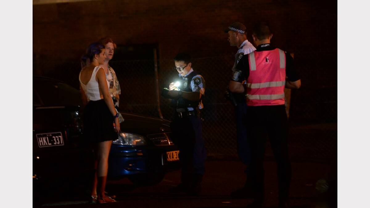 Wednesday night out in Newcastle. Patrons outside Argyle House talk to police. Picture: Marina Neil 