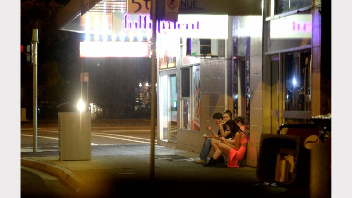 Wednesday night out in Newcastle. Patrons outside a food place corner of Hunter and Darby St, Newcastle. Picture: Marina Neil 
