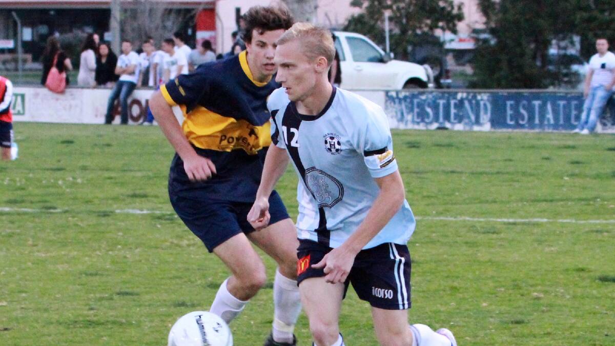 ON A MISSION: HFC’s Kyle Greaves takes on YSC’s Thomas Keenan in the GDFA grand final earlier in the month.  The season might be over but minor premiers Hanwood will take part in the prestigious Champion of Champions tournament this weekend.
