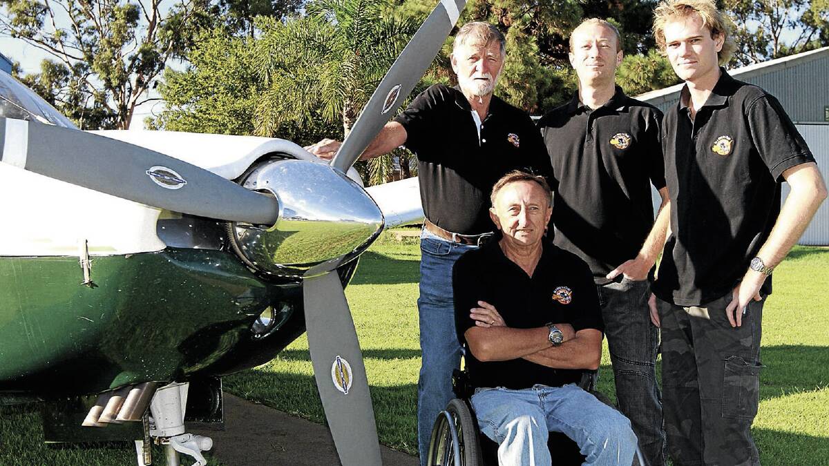 FLYING HIGH: Griffith Aero Club members Bob Frauenfelder, Paul McCaw, Michael Prince and (front) Gordon McCaw will be part of the flight crew helping Melbourne man Dave Jacka become the first person with quadriplegia to fly solo around Australia. Picture: Anthony Stipo