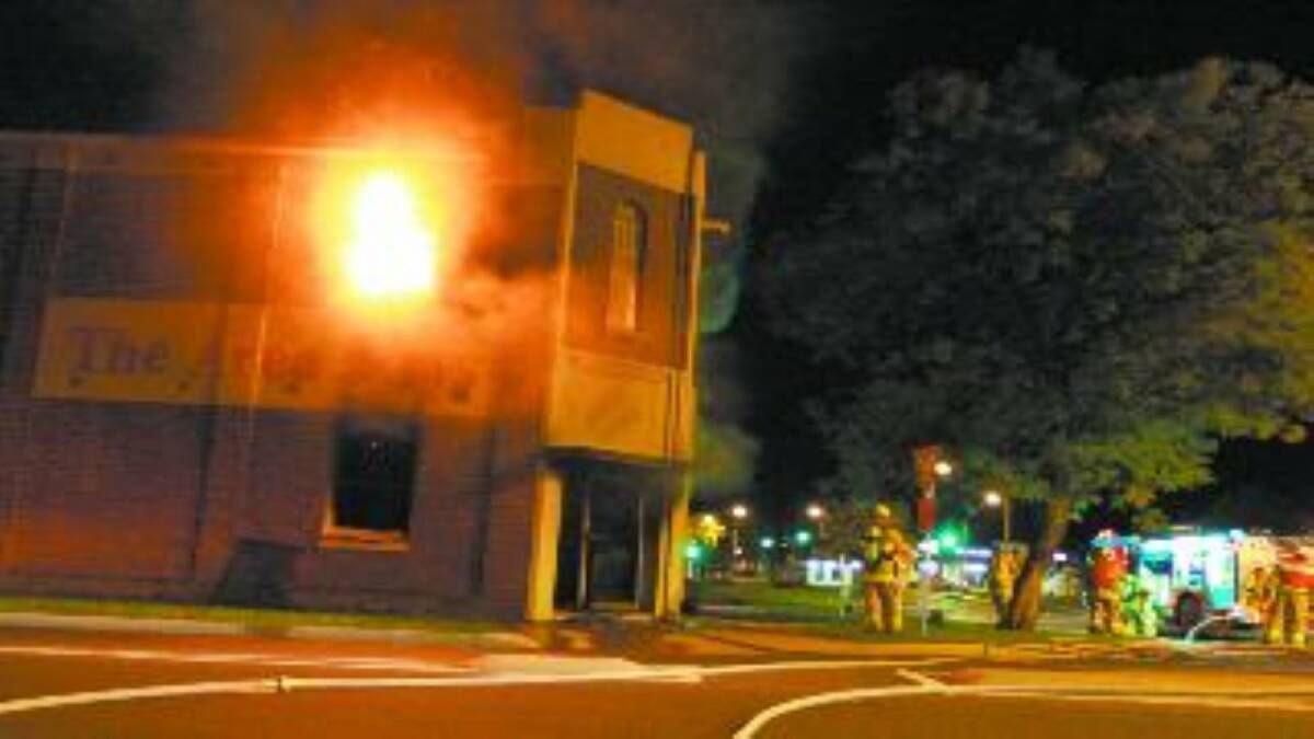 Firefighters battle the blaze at The Area News on Thursday night.