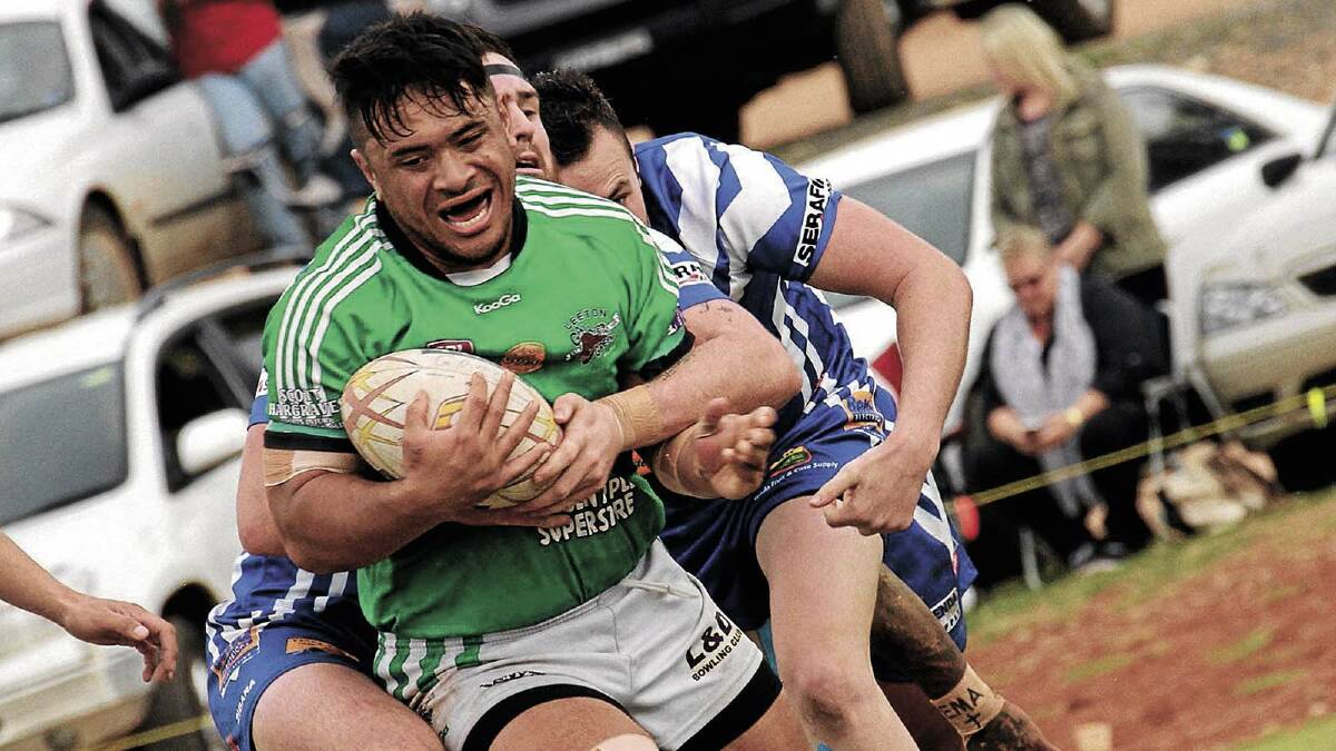 IN THE TRENCHES: Leeton matchwinner Chris Latu looks to negotiate his way through some heavy traffic.