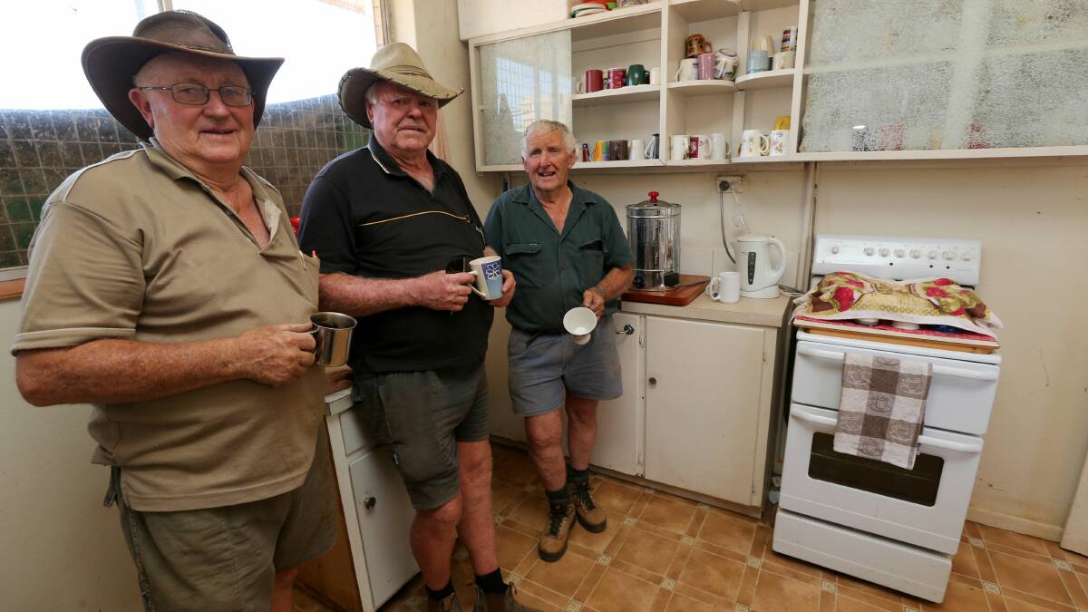 CRAMPED CUPPA: Griffith Shed for Men members Greg McCarten, Barry Gibbs and Alan Snow in their run-down kitchen.