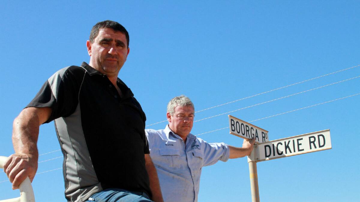 Nericon farmers Wayne Andreatta (left) and Rocky Rombola are demanding action on the "atrocious" condition of Boorga Road, which, at peak times, carries thousands of tonnes of produce out of Griffith daily.