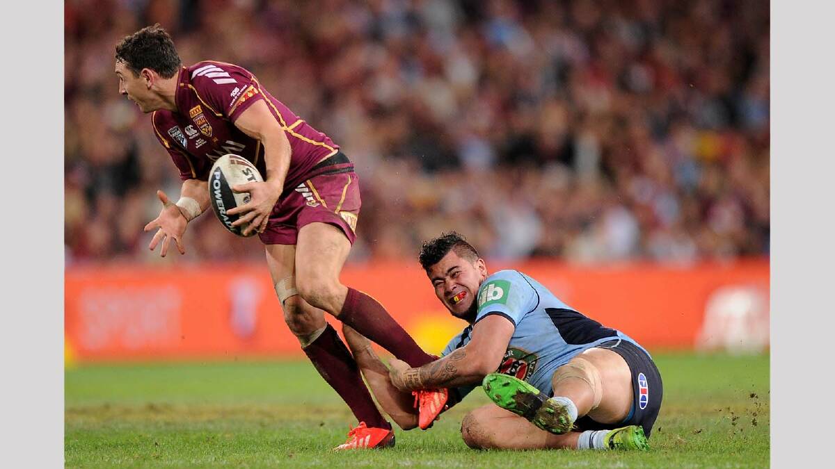 Andrew Fifita ... brings down one of Queensland's biggest weapons, Billy Slater, in game two. Picture: Getty Images