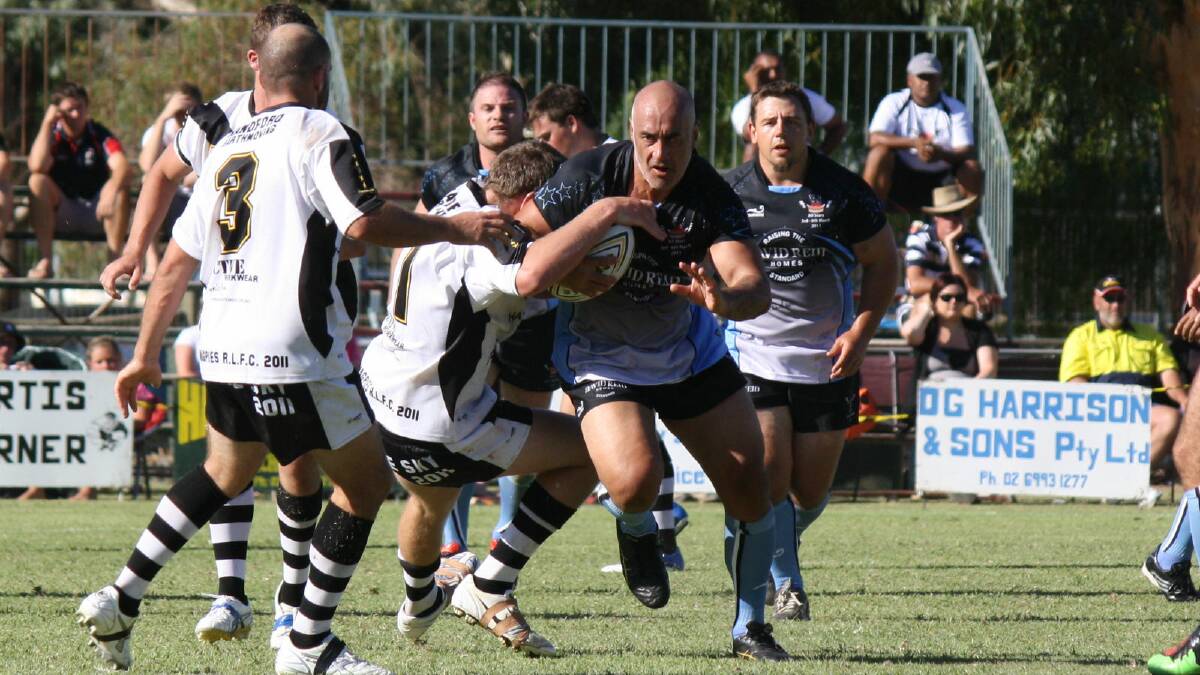 Quentin Pongia breaks through the Magpies defence during the Pie in the Sky exhibition match in Hay in 2011. Pongia will pull on the black and white for the Magpies this year.