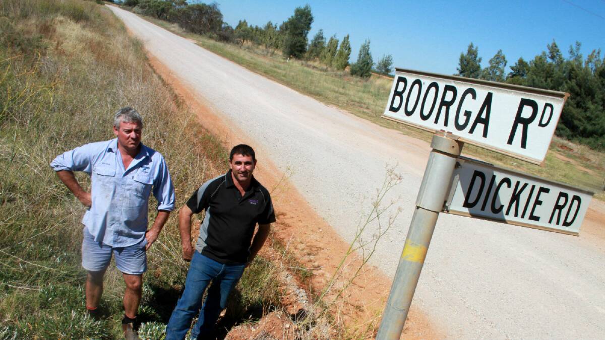 Nericon farmers Wayne Andreatta (left) and Rocky Rombola are demanding action on the "atrocious" condition of Boorga Road, which, at peak times, carries thousands of tonnes of produce out of Griffith daily.