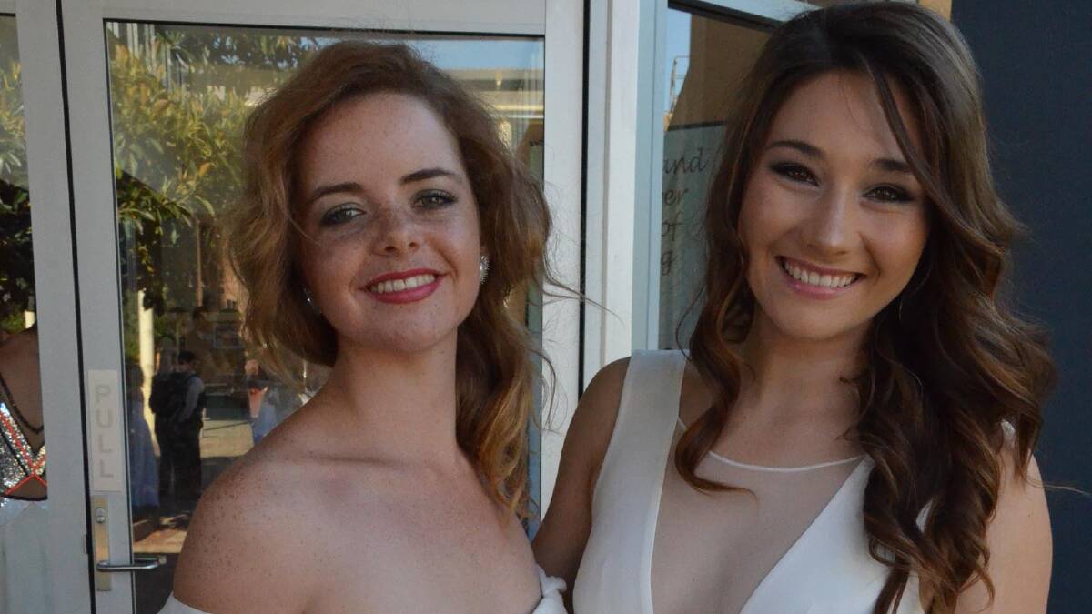 GLAMOROUS: Looking stunning ahead of their year 12 graduation dinner on Friday night are Anna Potgieter and Joany Badenhorst.
