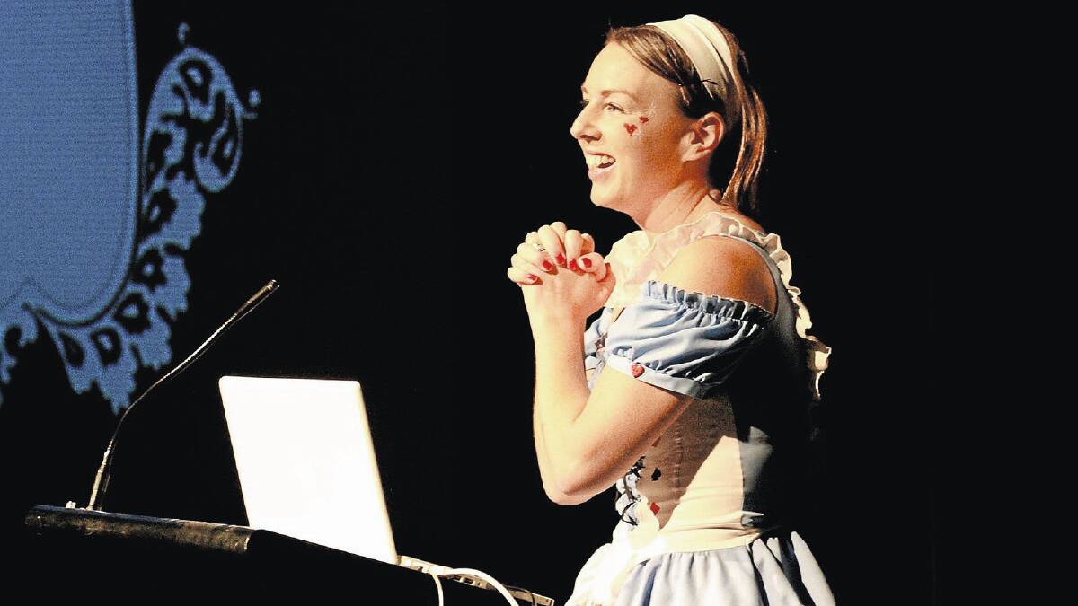 New Griffith Regional Theatre manager Sarah Boon enthuses to the crowd at an Alice in Wonderland-themed season launch on Saturday. 