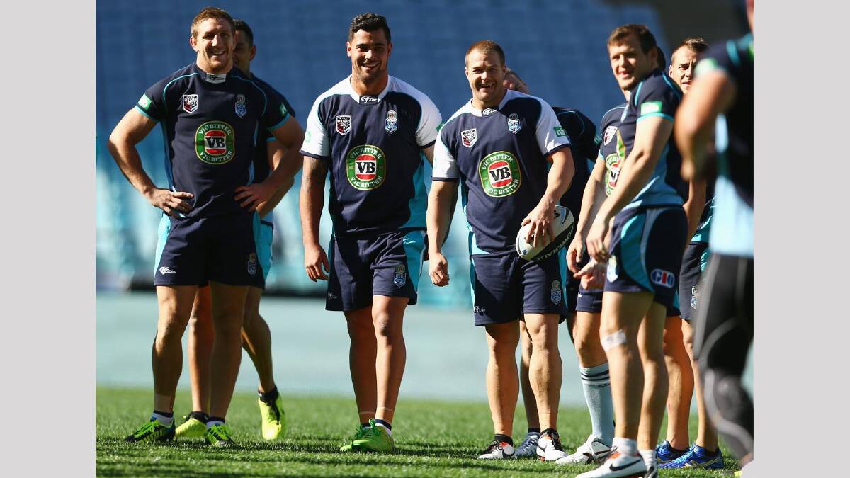 Andrew Fifita ... sharing a joke with Ryan Hoffman and Trent Merrin in the Blues training camp. Picture: Getty Images