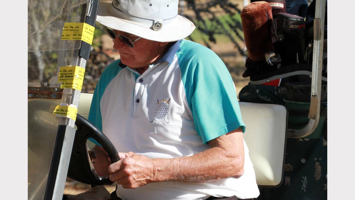 John Bortolazzo updates the scorecard in his golf cart. Picture: Anthony Stipo