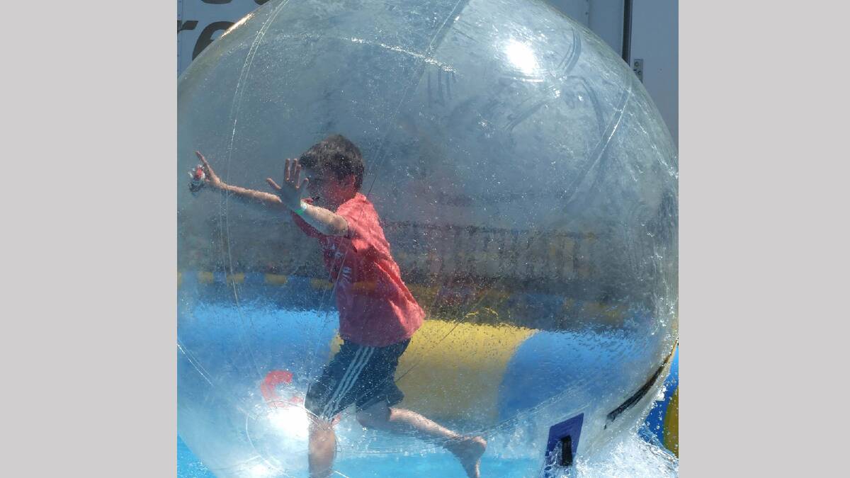 Reece Fabris, 10, enjoys the water ball at the Griffith Show. 