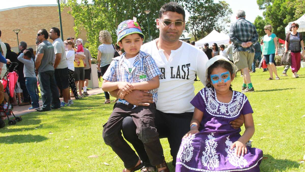 Imran Syed (centre) with children Rayyan an, 4, and Rida, 6, at the Griffith Multicultural Festival. Picture: Anthony Stipo