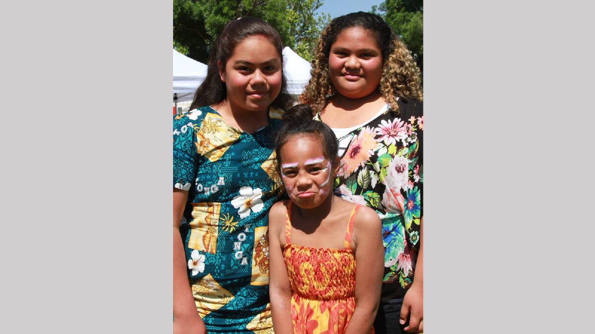 Rossana Tupa, 11, Ojhan Samuelu, 9, Salina Finau, 11, at the Griffith Multicultural Festival. Picture: Anthony Stipo