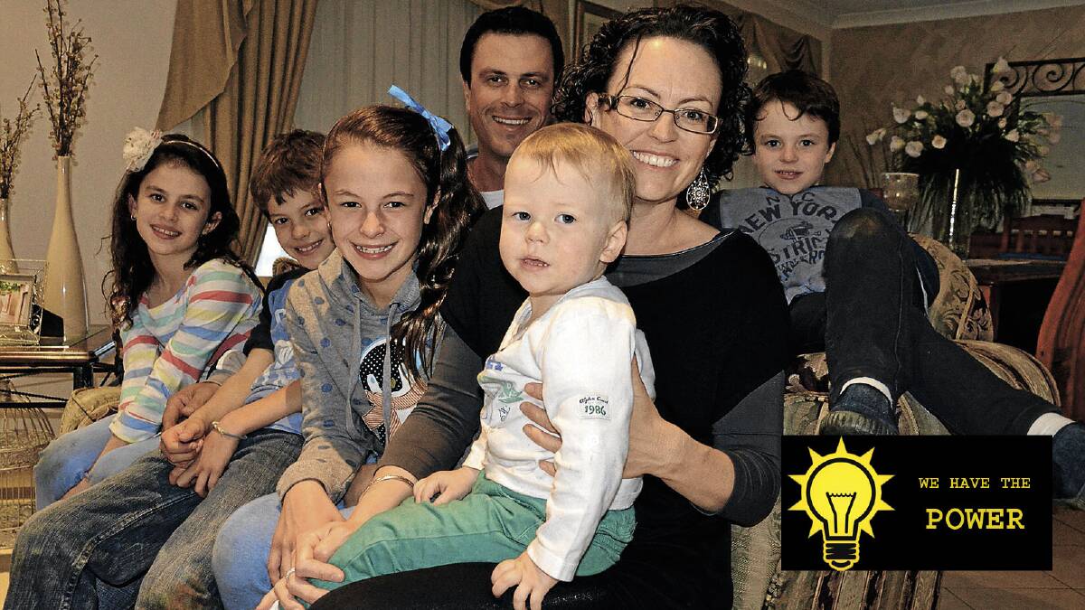 TIME TO CHANGE: Wayne and Lea Salvestro with Lexi, 8, Mitch, 10, Lara, 11, Marcus, 2, and Mason, 7, are sick of ever-increasing power bills with the last one coming in at close to $3000.