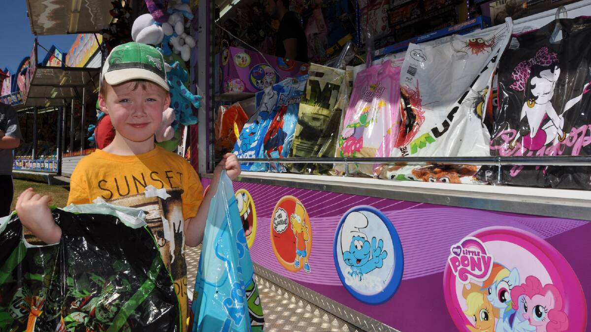 William Lonergan, 5, stocking up with showbags at the 2013 Griffith Show. 