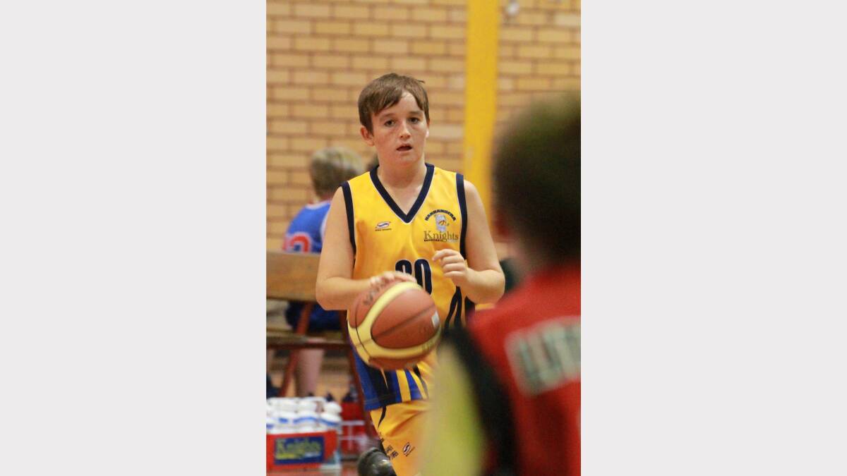 Narrandera Knights' Jack Grintell dribbles against the Lithgow Lazers in the junior state basketball competition. Picture: Anthony Stipo