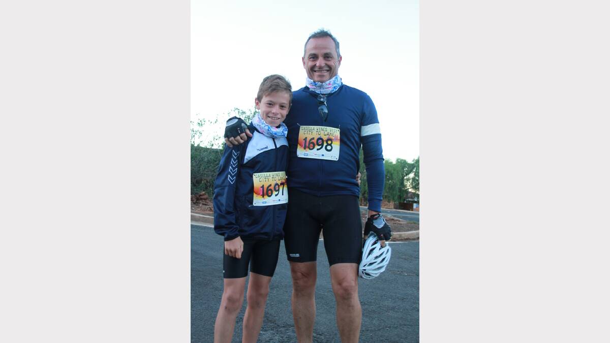 City to Lake fun run - Massimo Forlico, 10, with his dad Anthony. Picture: Anthony Stipo