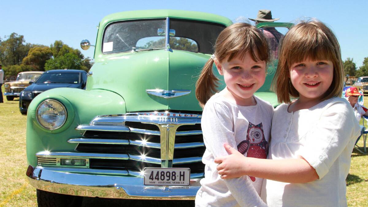 CUTE: Rhiannon, 5, and Giaan Watt, 6, enjoy a day out at the Riverina Motor Show on Saturday. Picture: Anthony Stipo