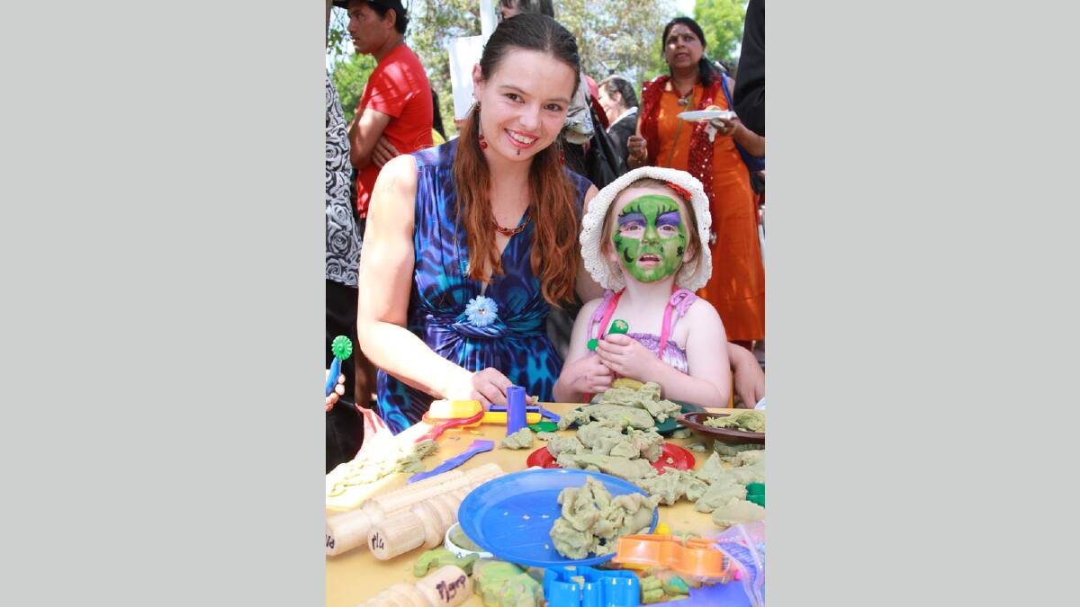 Nickole Bolewski with her daughter Matilda, 4, get in to the spirit of the Griffith Multicultural Festival in Memorial Park on Saturday. Picture: Anthony Stipo