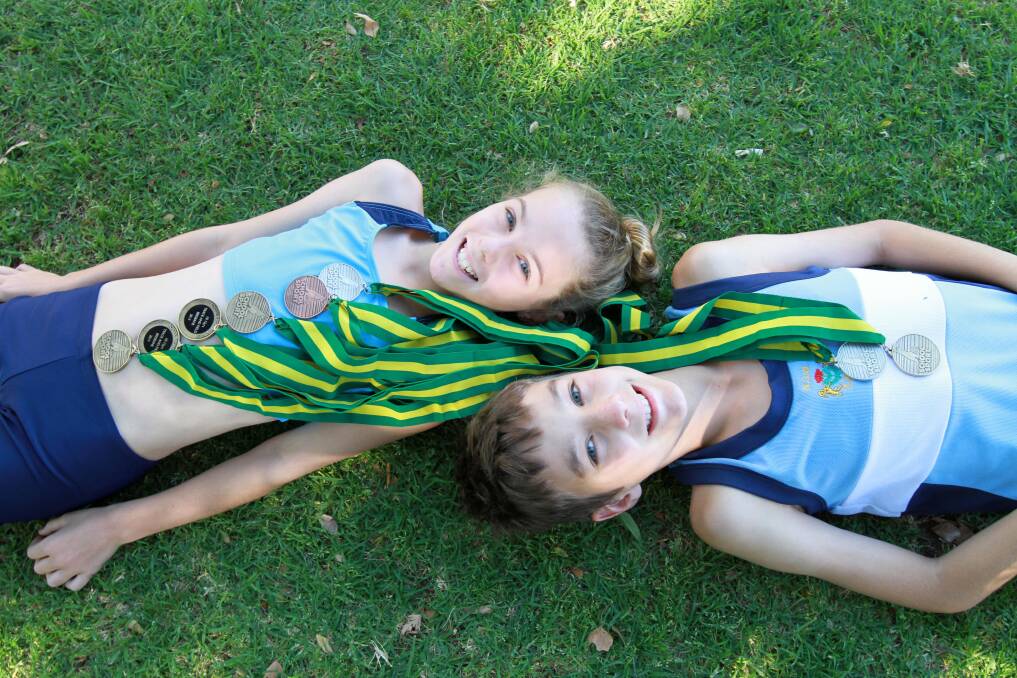 St Pat’s students Sarah, 10, and Noah Negus, 12, are back from last week’s School Sport Australia track and field championships with yet another bundle of medals. Picture: Anthony Stipo