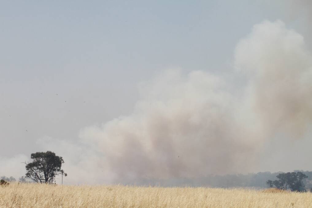 ON FIRE: Plumes of smoke from the Rifle Range Road fire on Wednesday afternoon.