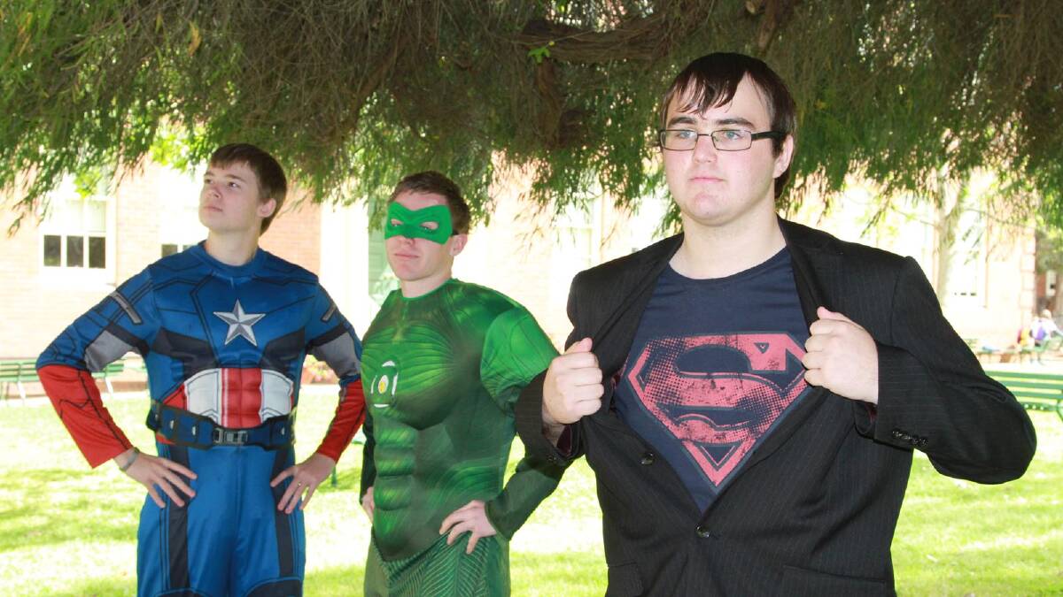 Daniel Thornton (front) chose Clark Kent while (back) Michael Godfrey donned Captain America's outfit and Matt Hardwick opted fro Green Lantern for a Griffith High School year 12 fundraiser. Picture: Anthony Stipo