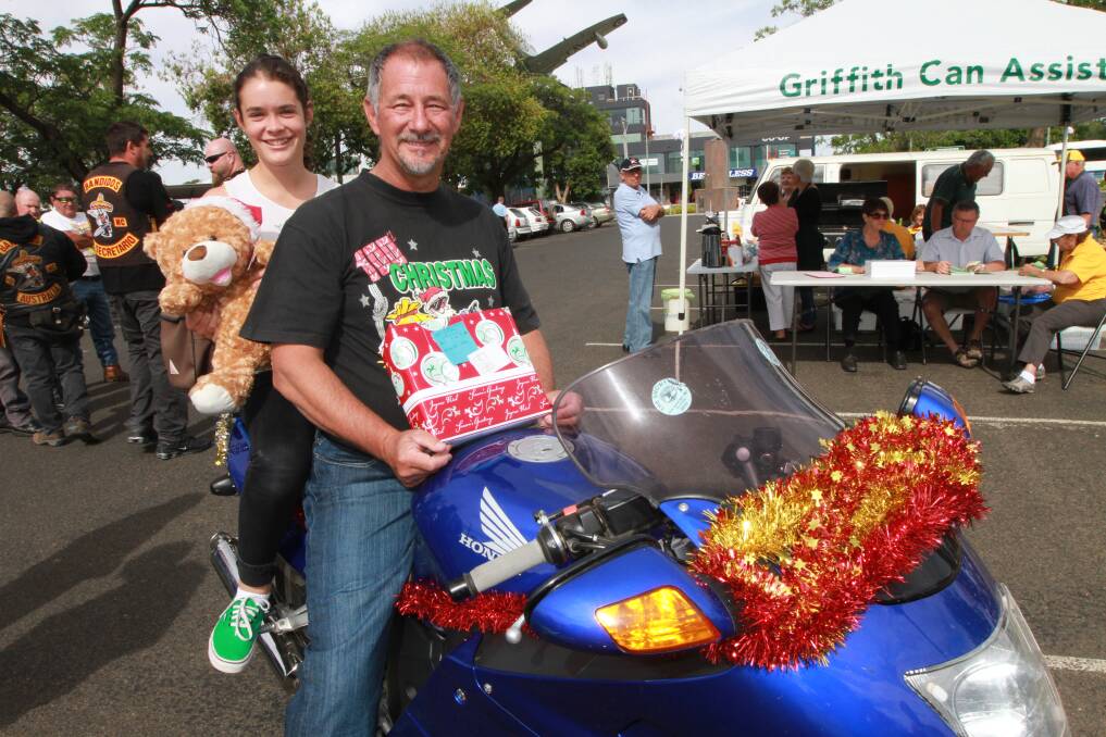Chloe Anthony is all set for the 2013 Griffith Toy Run, with founder Locky Miller. Picture: Anthony Stipo