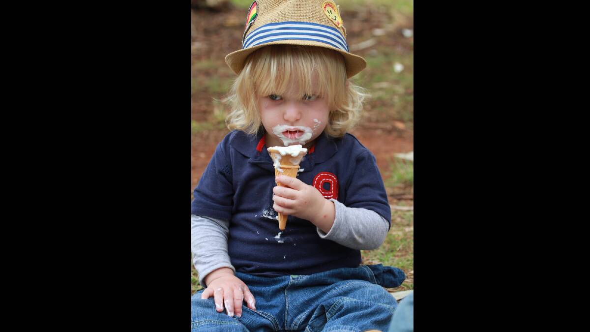 Max Brown, 20 months, takes his ice cream seriously at La Festa on Easter Saturday. Picture: Anthony Stipo