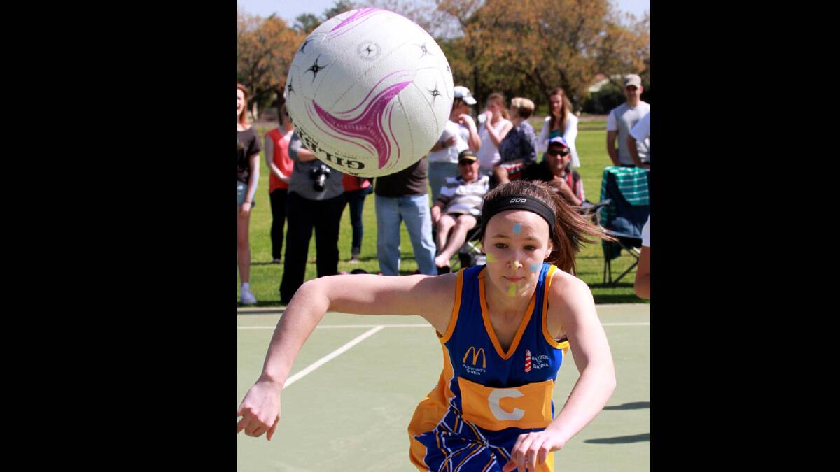 Shooting Stars' Briana O'Keeffe has her eye on the ball during the winter netball competition's 14 years C grade grand final. Picture: Anthony Stipo