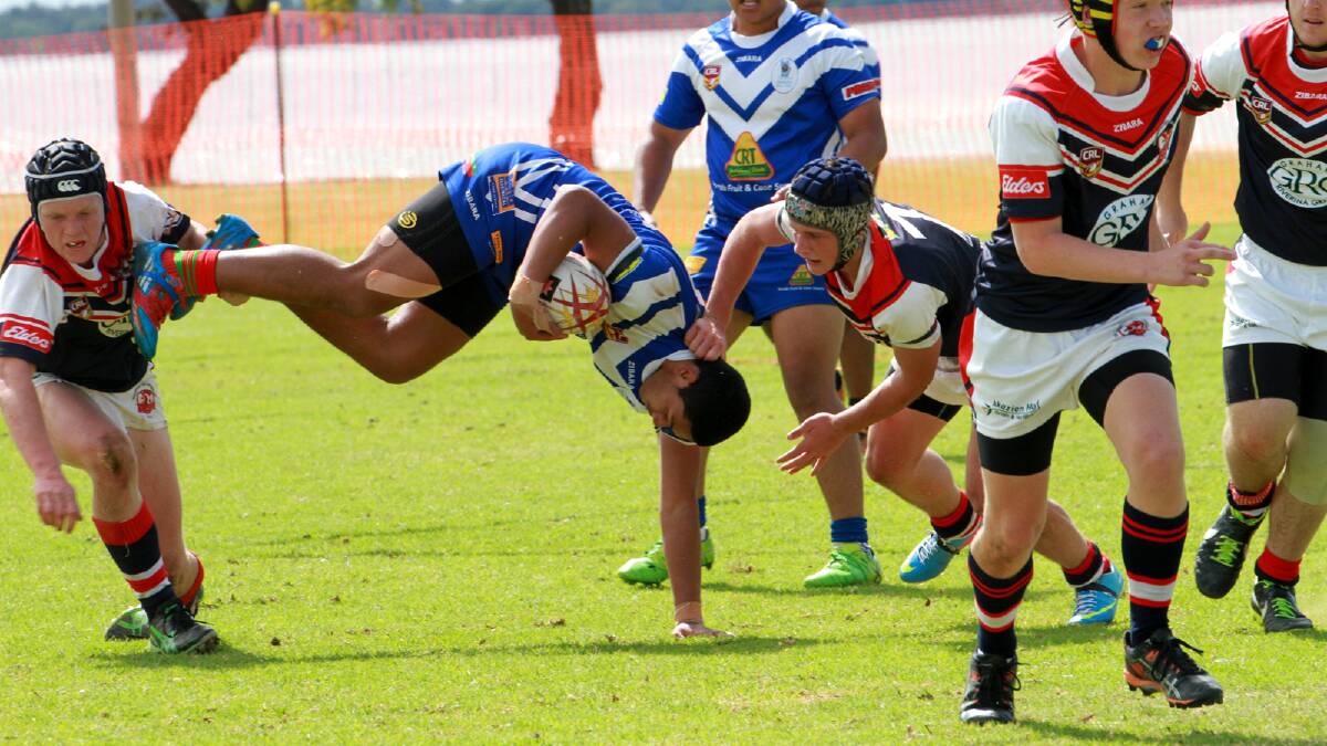 Yenda's Ali Ngahe is tackled during the Group 20 under 16s grand final against DPC. Picture: Anthony Stipo