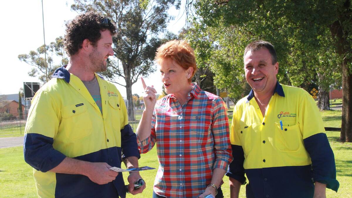 Simon Carusi and Tony Romeo catch up with Pauline Hanson during her visit to Griffith in the lead-up to the 2013 election. Picture: Anthony Stipo