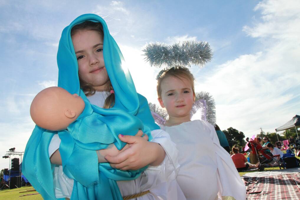 IN FINE VOICE: Sisters Emily, 5 and Layla Codemo, 3, dressed up for Griffith Carols by Candlelight on Sunday night at the Exies Oval.