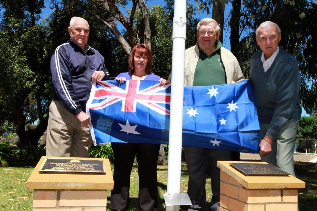FITTING TRIBUTE: (From left) Don Stacy, Hanwood Public School principal Monica St Baker, Jim McGann and Roy Stacy stand behind the plaques that will be dedicated to two former Hanwood Public School teachers next Monday. Picture: Anthony Stipo
