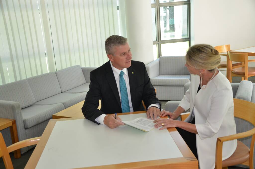 Member for Riverina, Michael McCormack, discussing the MRI petition with Assistant Minister for Health, Fiona Nash. 