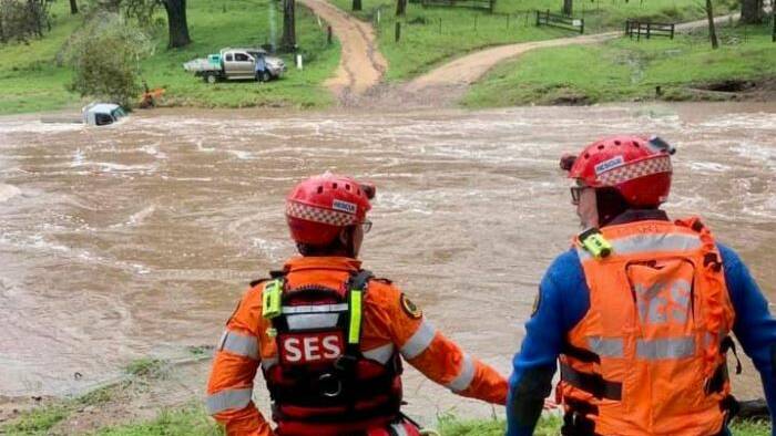 SES teams have rescued a man and his two dogs from a vehicle in flood waters at Double Creek. Photo: supplied 
