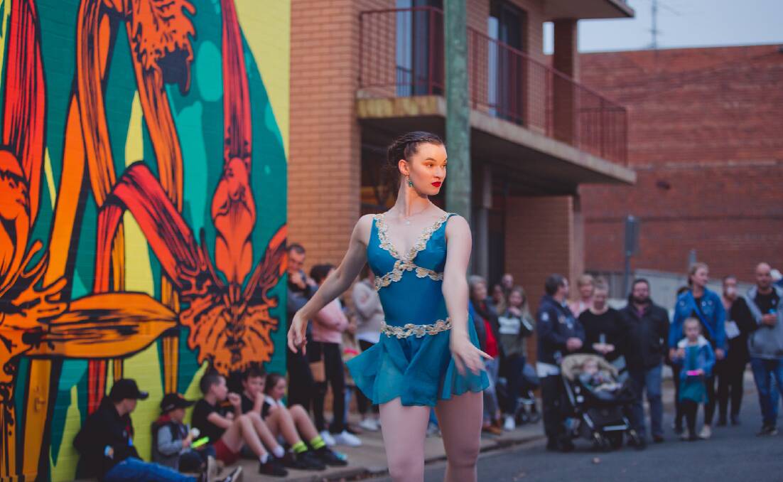 LIGHTING UP BANNA LANE: Ballerina Ellise Pellizzer performing her pop up performance on one of the evenings. PHOTO: Supplied 