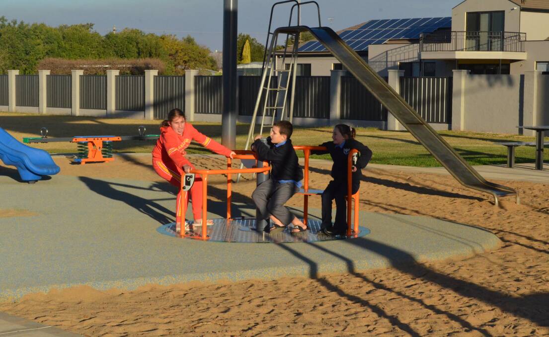 SPIN CLASS: Emma Cunial, Michael Cunial and Evie Beer were suitably impressed with the new playground equipment. PHOTO: Cai Holroyd