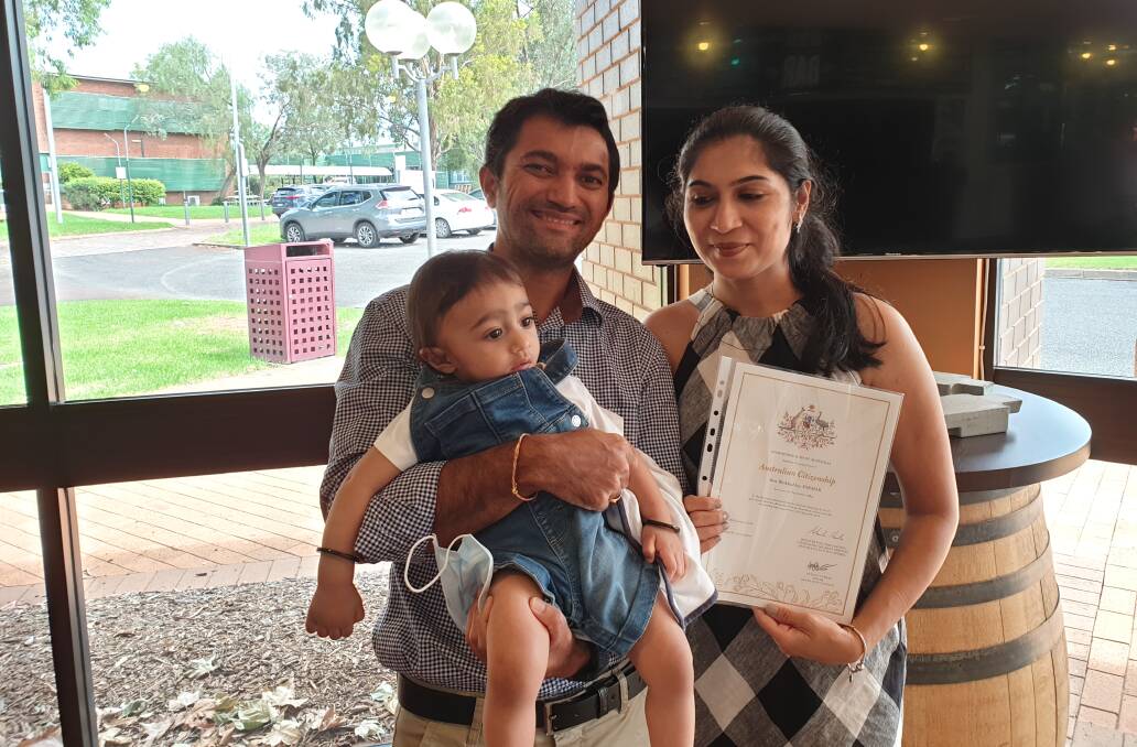 WELCOME: Arti Parmar with her new certificate of citizenship, with husband Sanjay Devalia and little Tivaan Devalia. PHOTO: Cai Holroyd